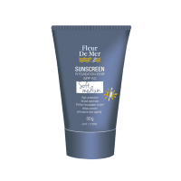 Fleur De Mer tinted sunscreen in the shade of soft medium. In a 50ml blue tube with a sun design on the front