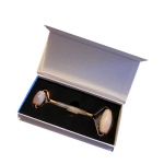 Pink Rose Quartz facial roller in white open box