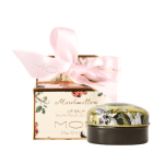 MOR Marshmallow Lip balm out of box. Box in background with a pink ribbon bow