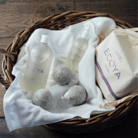 ECOYA Lavender & Chamomile Linen Spray with laundry liquid in a basket