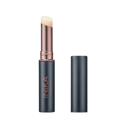 INIKA Organic lip balm with lid off showing clear lip balm.