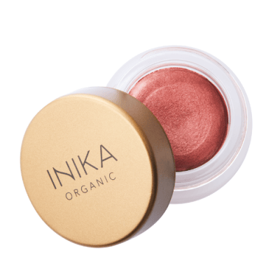 INIKA lip and cheek cream in petals colour shade. Gold lid tiled on small tub showing a orange/red colour gloss