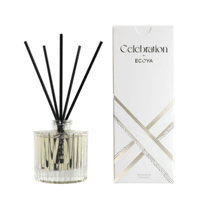 ECOYA Celebration White Musk + Warm Vanilla Diffuser in glass vessel with black reed sticks.