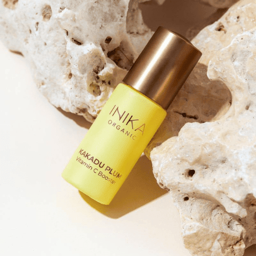 INIKA Organic Kakadu Plum Vitamin C Booster laying on rocks