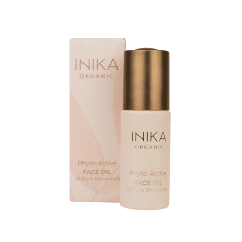 inika face oil beside box.