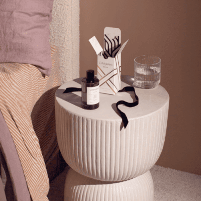 ECOYA Celebration White Musk + Warm Vanilla Room Spray on bedside table with box