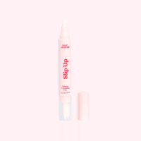Silly George Slip Up Makeup Correction Pen with lid off on a pink backgroud